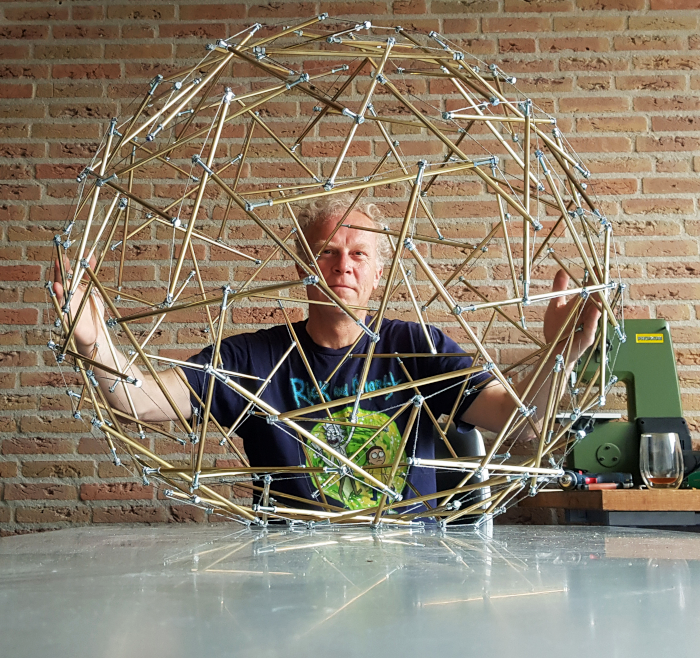 Gerald holding a larger round tensegrity piece.
